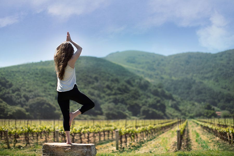 Woman doing yoga in Vineyard
