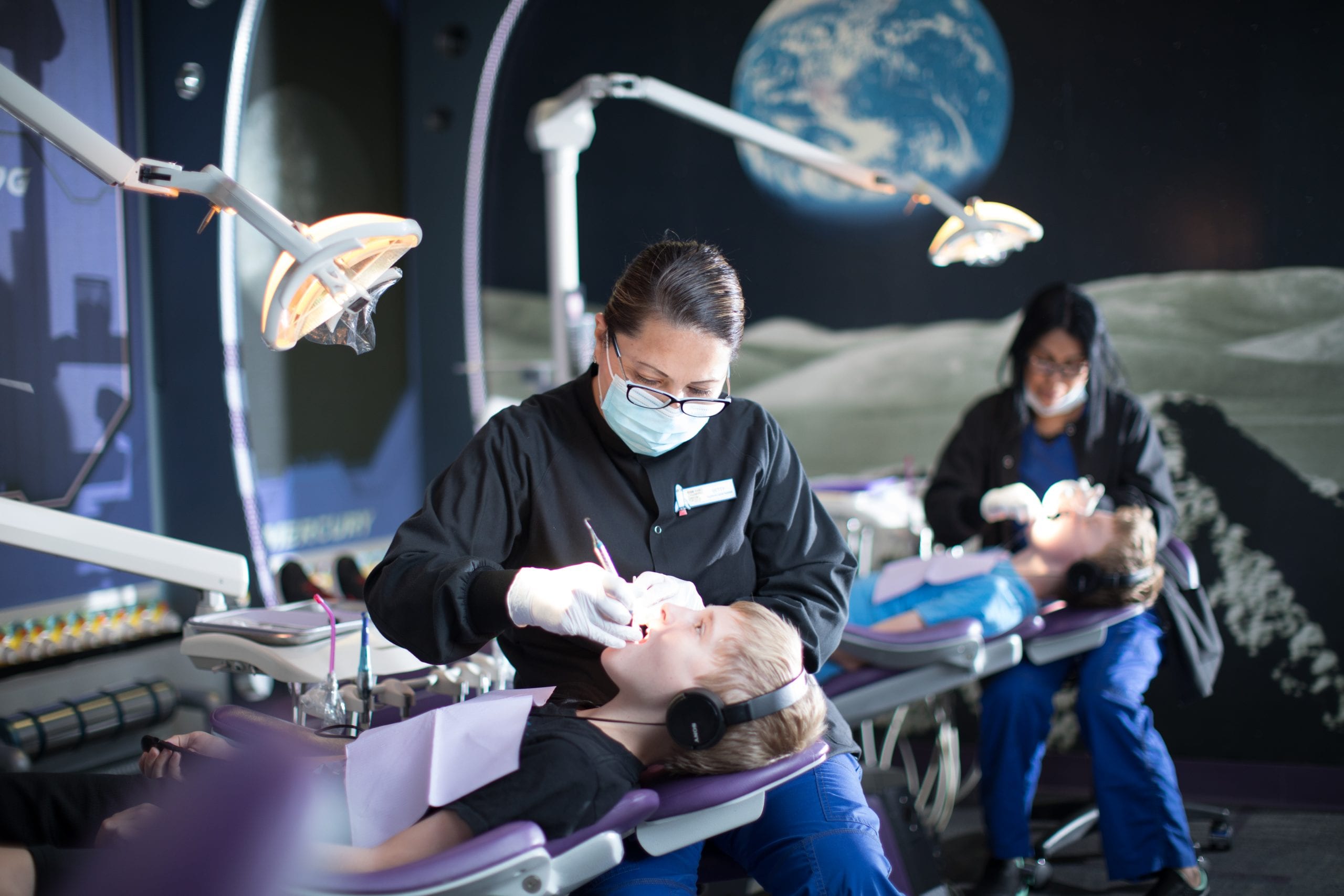 'Childrens Dental Group' Hygienist Cleaning Patient