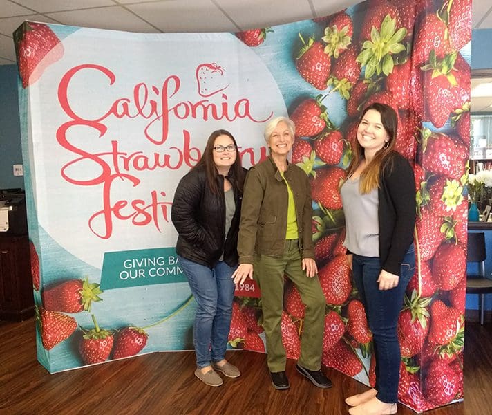 California Strawberry Festival Curved Backdrop California Strawberry Festival Backdrop with People Posing