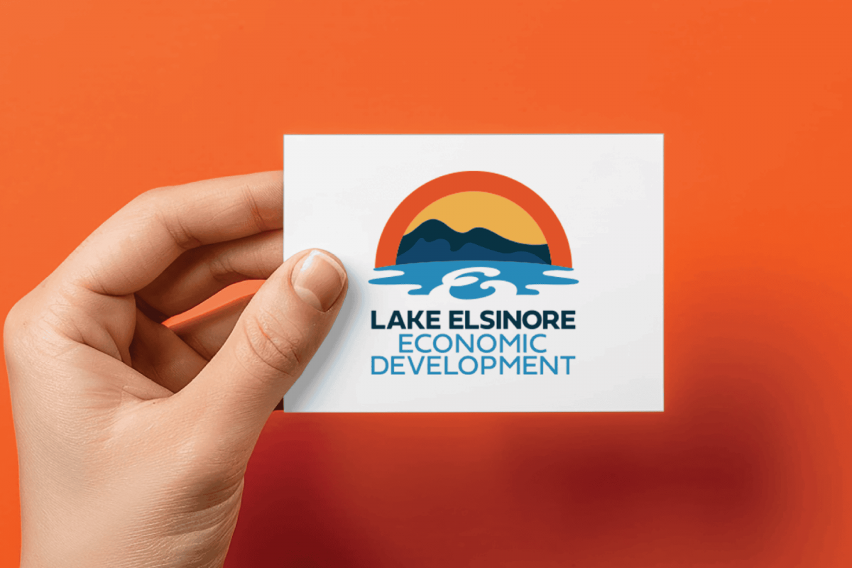 lake elsinore logo behind held on card