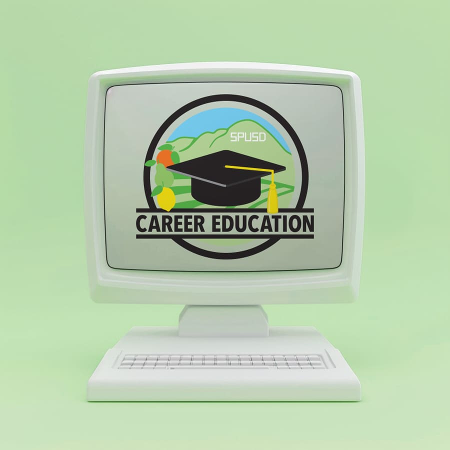 SPUSD_Portfolio_01 A vintage computer showcases the Career Education logo, featuring a graduation cap, globe, and diploma. This emblem symbolizes the dedication to learning found in programs like those within the Santa Paula Unified School District.