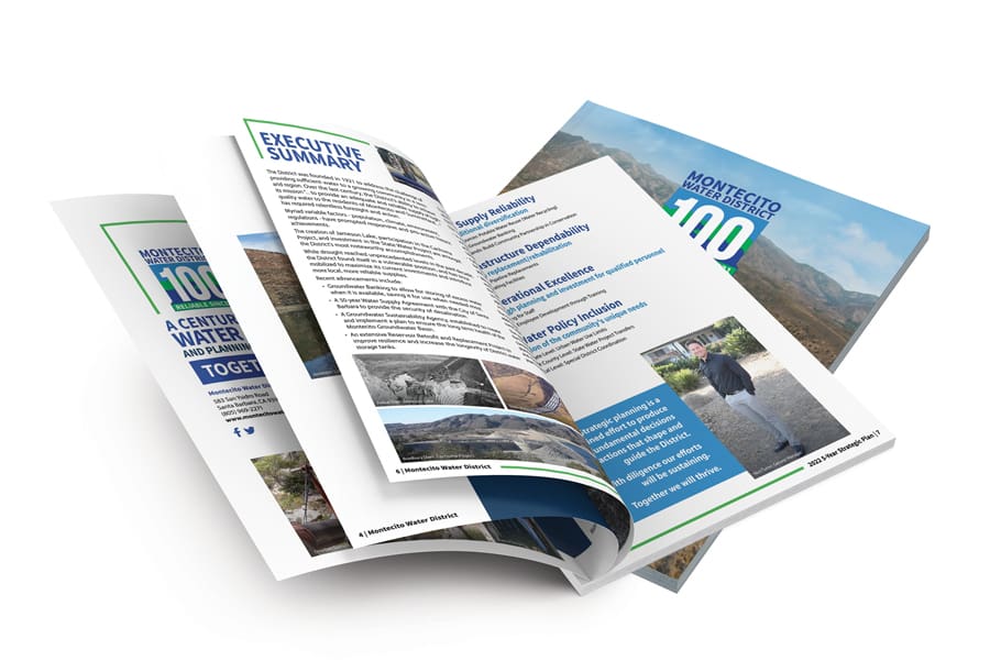 MWD_100yr_Plan_Portfolio_05v2 Open brochures showcasing pages filled with text and images, with a cover titled Montecito Water District 100 Years. This special Montecito Report celebrates a century of service and water management excellence in the community.