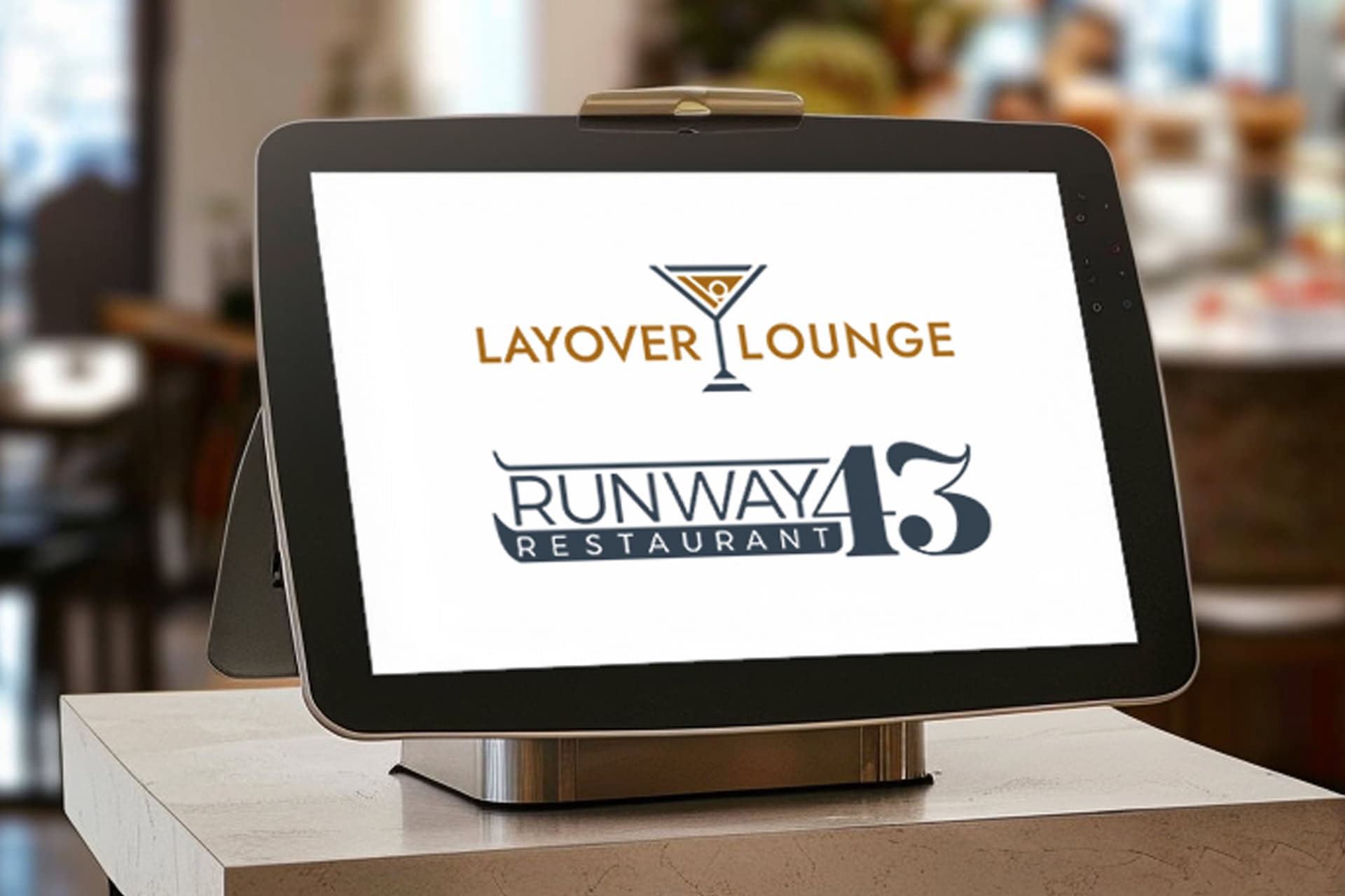 Modern digital kiosk showcasing Lounge and restaurant branding for event or menu display.