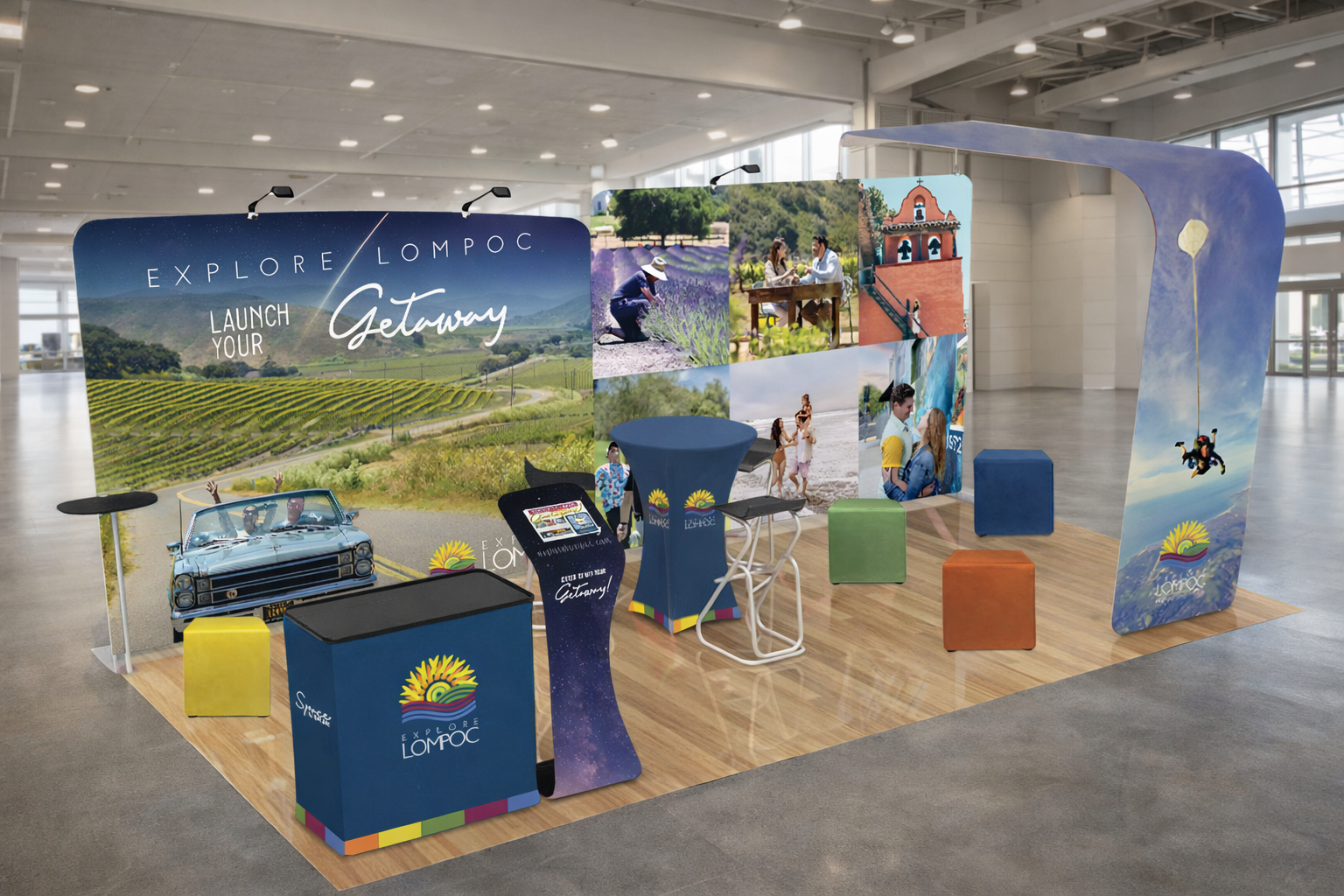 Lompoc tourism booth at an indoor event showcasing local attractions and branding.