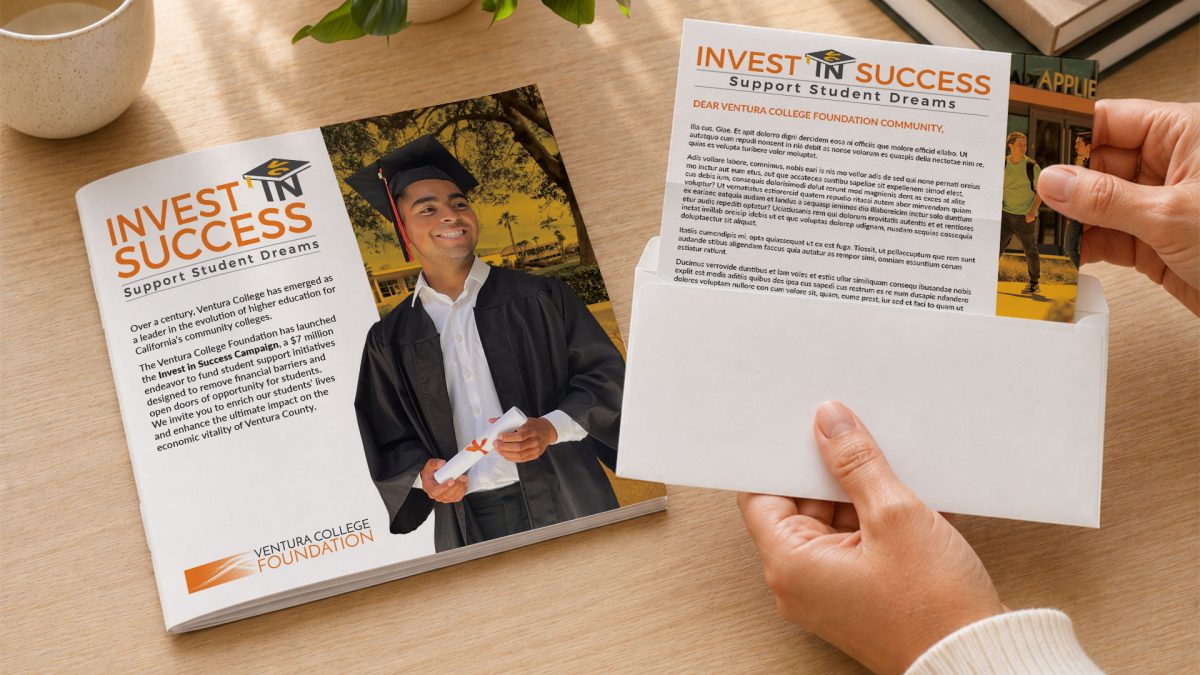 Person holding VC Foundation brochure with a graduate in cap and gown.