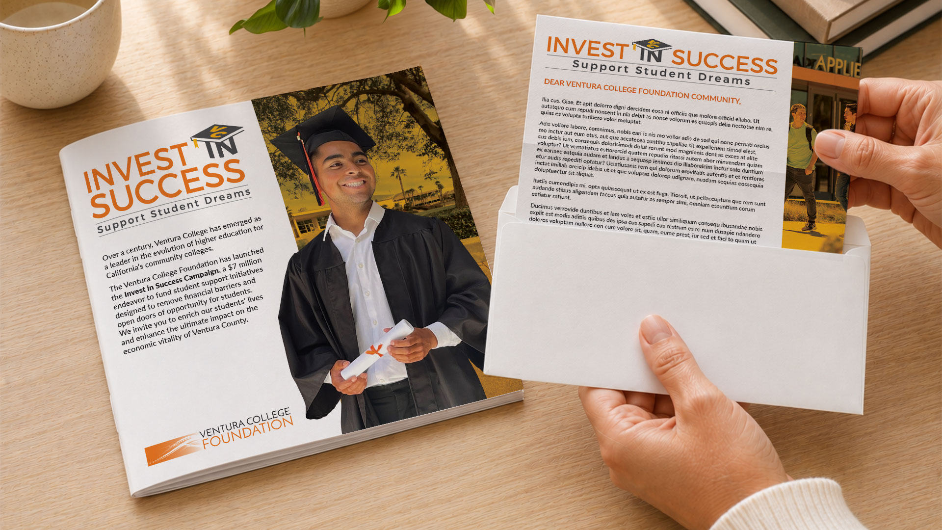 Person holding VC Foundation brochure with a graduate in cap and gown.